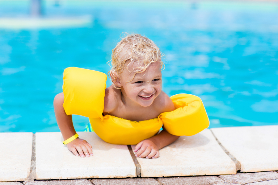 Little Boy In Swimming Pool