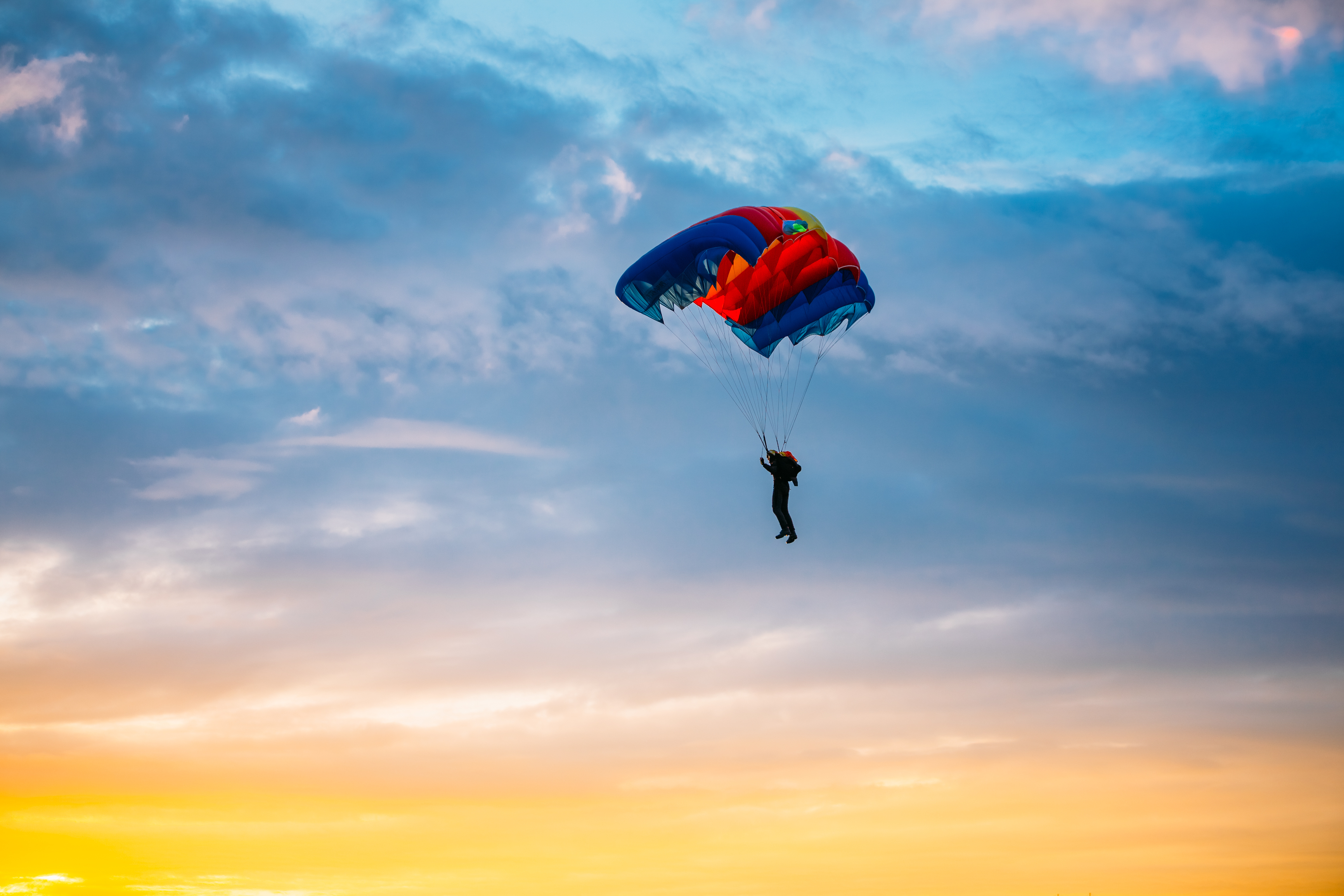 Skydiver On Colorful Parachute In Sunny Sky RateMDs Health News