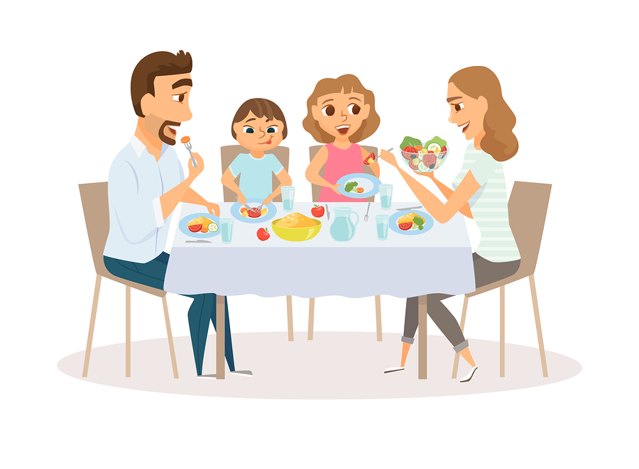 Family eating meal around kitchen table