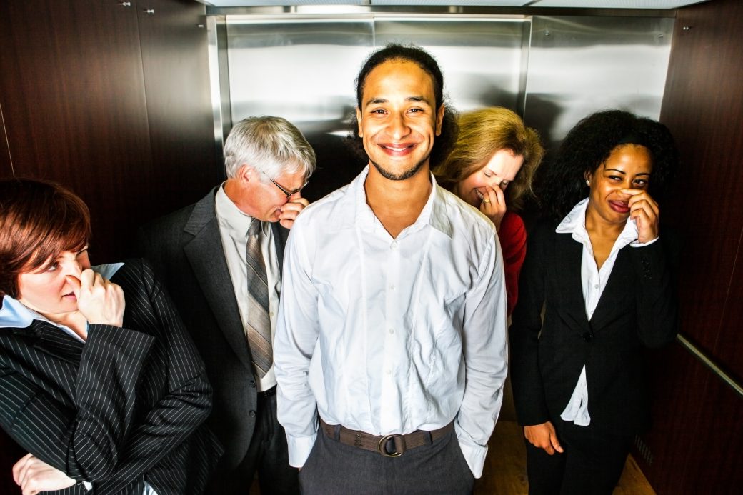 man smiles after farting in elevator
