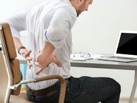 How Sitting on the Floor Helps Solve Lower Back Pain